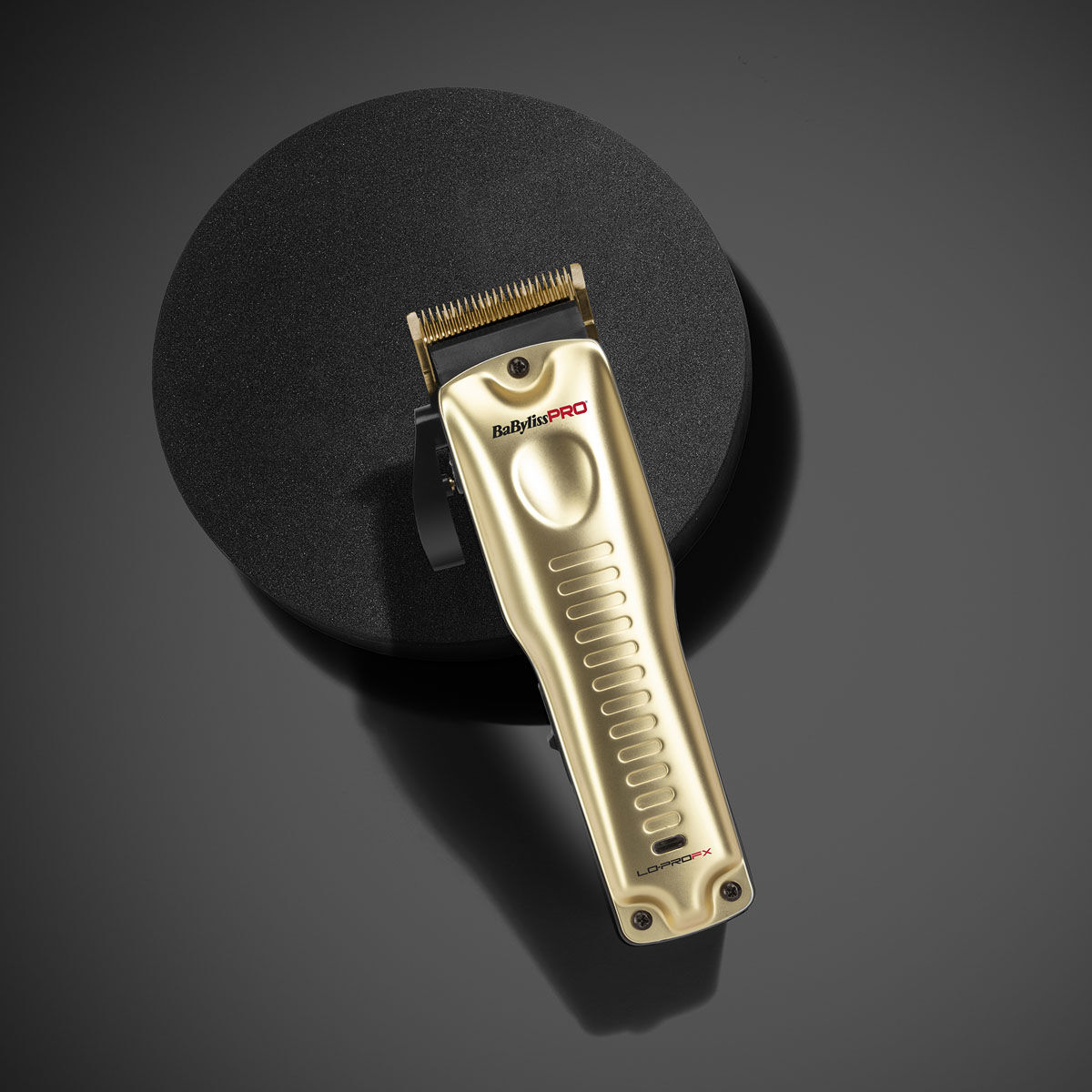 Gold Lo-Pro FX Cordless Clipper on dark background
